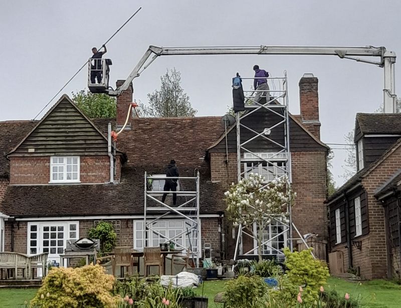 The Roof Moss Cleaners using cherry picker and scaffolding to clean roof safely and professionally in Wendover, Buckinghamshire